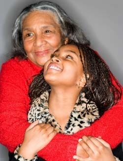 an older woman hugging a younger woman.
