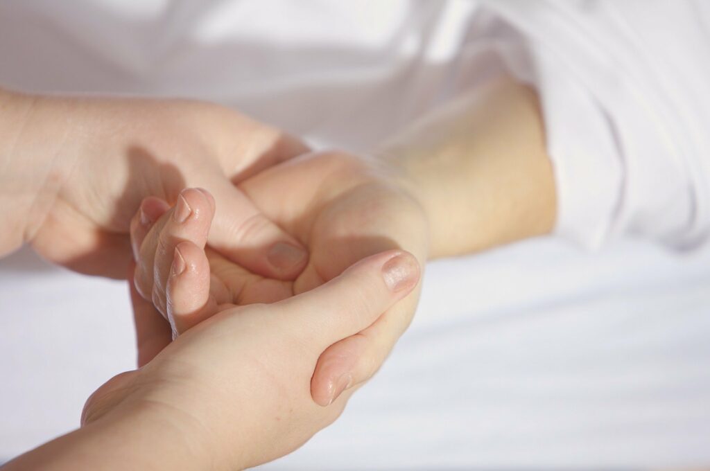 A hand holding a piece of paper