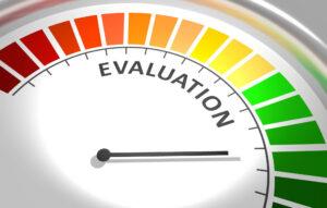 Circular evaluation gauge labeled EVALUATION with a red-to-green color gradient and a needle pointing to mid-range.